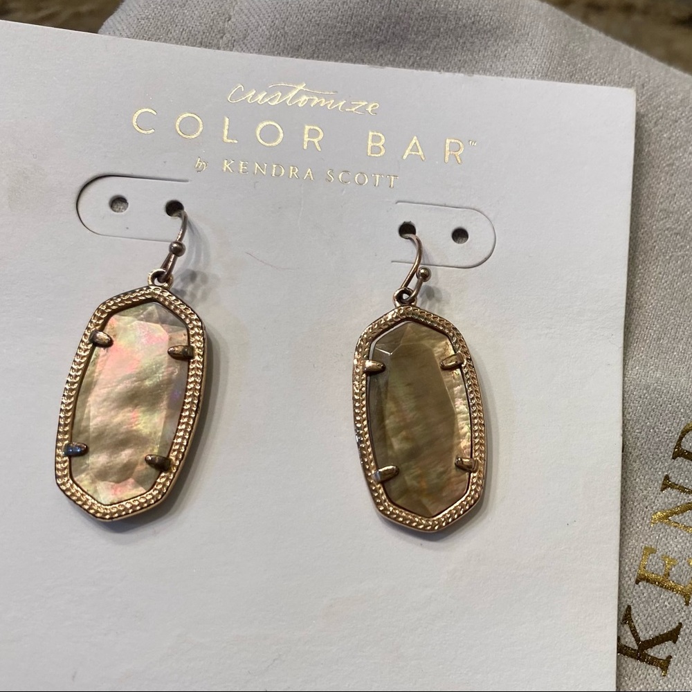 Kendra Scott Dani Gold Earrings with Brown Mother of Pearl center stone.